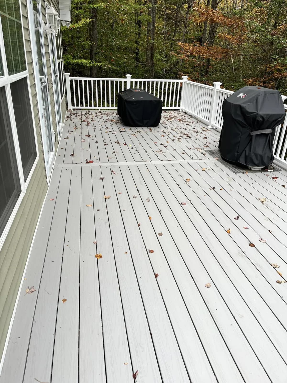 Finished composite deck with patio set — Decks project in Central NH by A&E Home Improvement