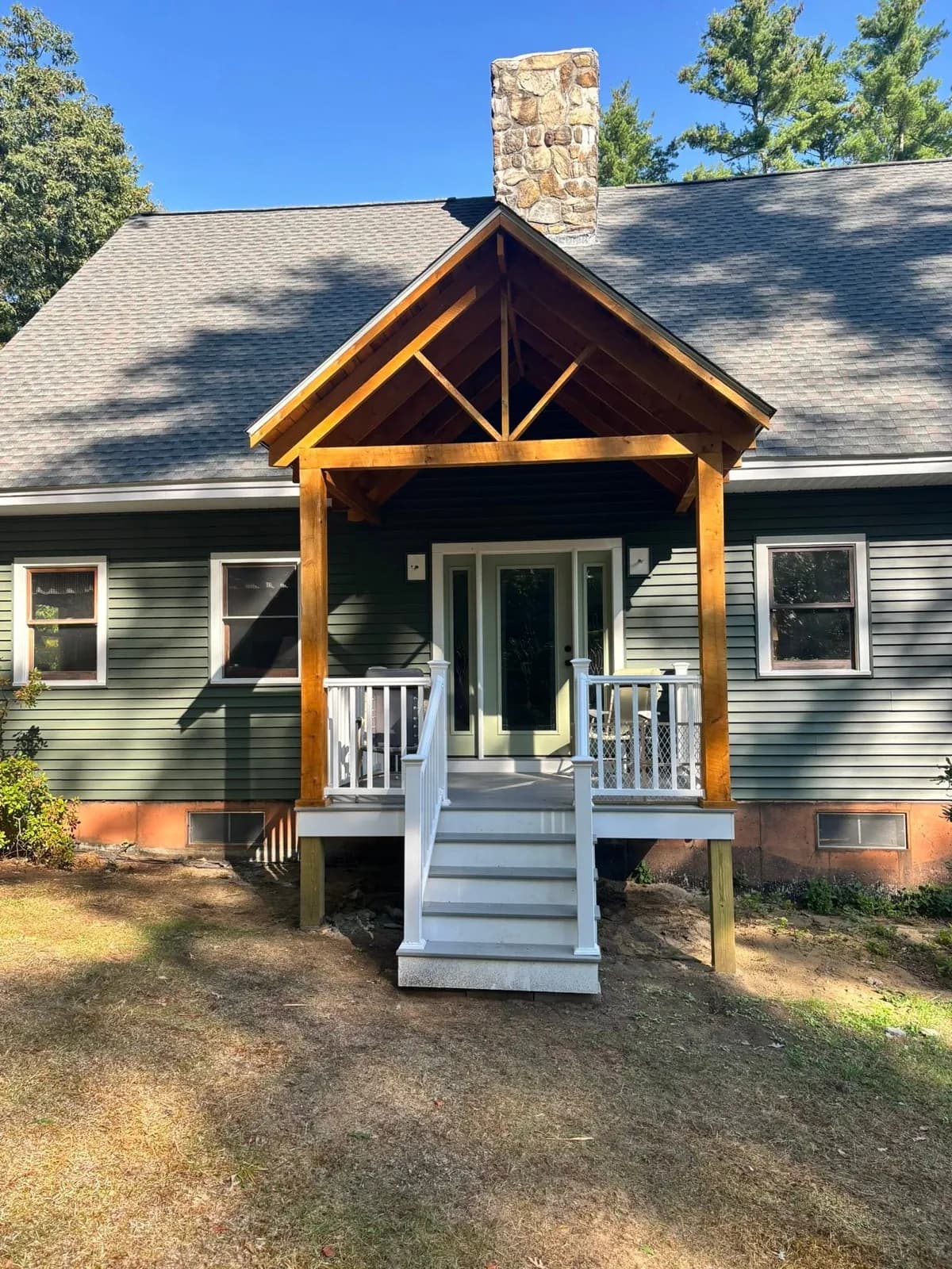 Timber-frame entry porch on a green cape — Design/Build project in Central NH by A&E Home Improvement
