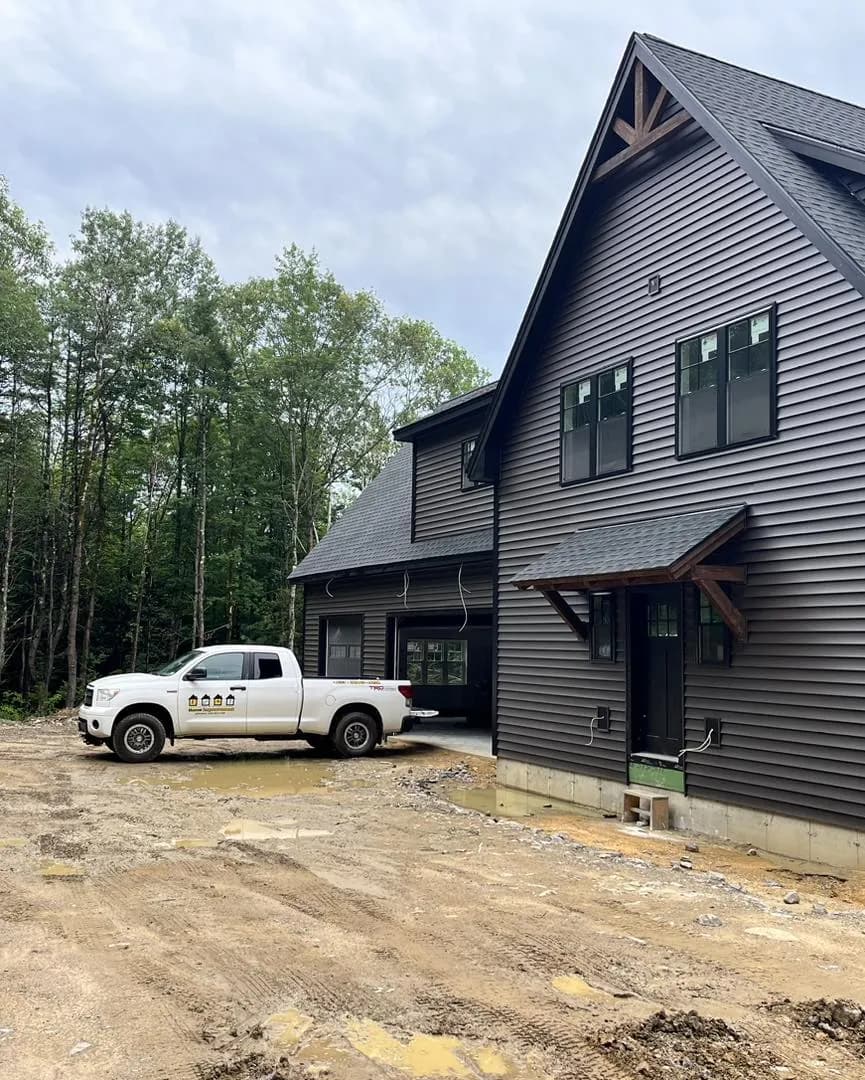 New home with a timber-truss entry gable — Design/Build project in Central NH by A&E Home Improvement