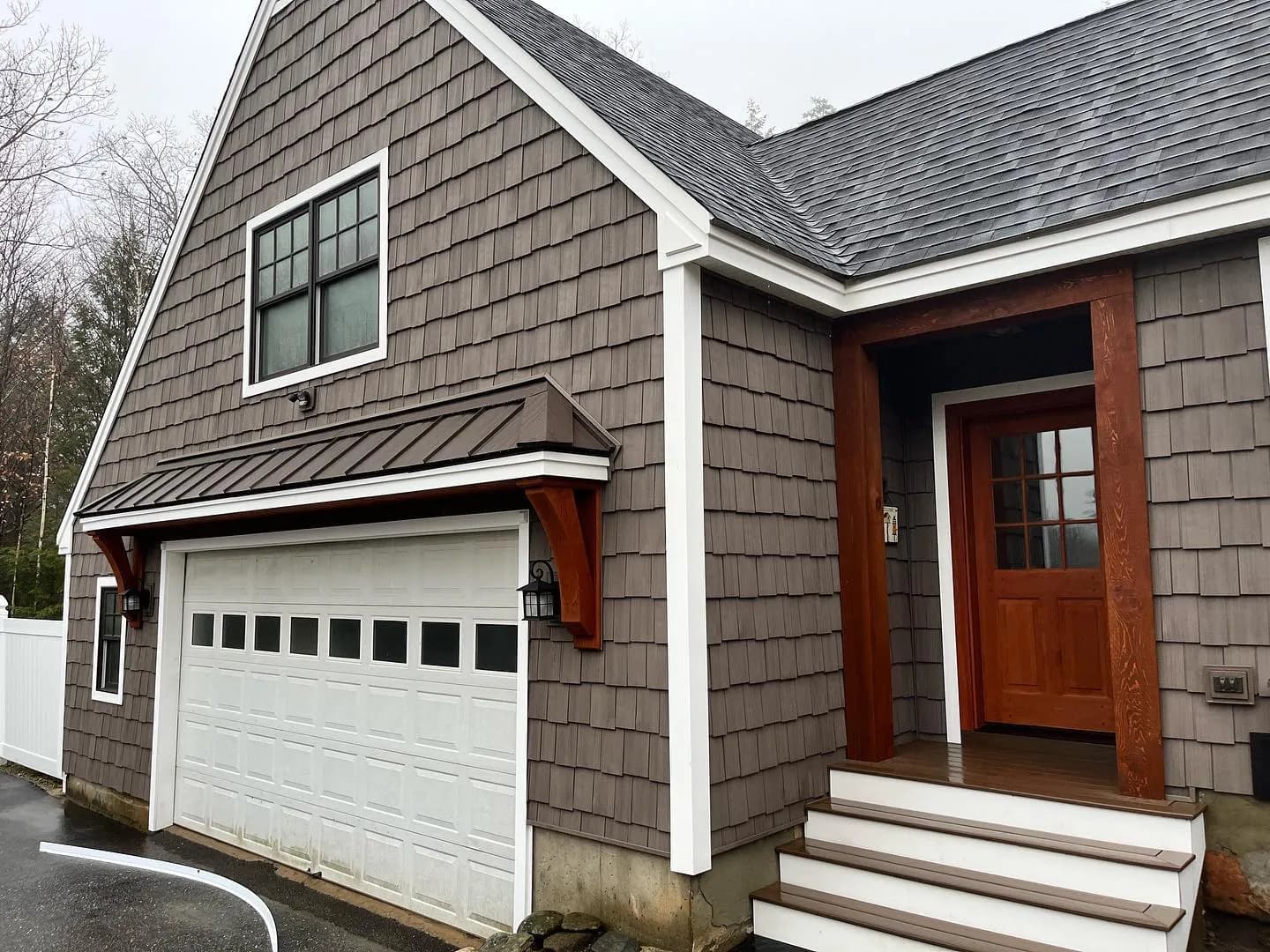 Garage with timber brackets and entry steps — Garages project in Central NH by A&E Home Improvement