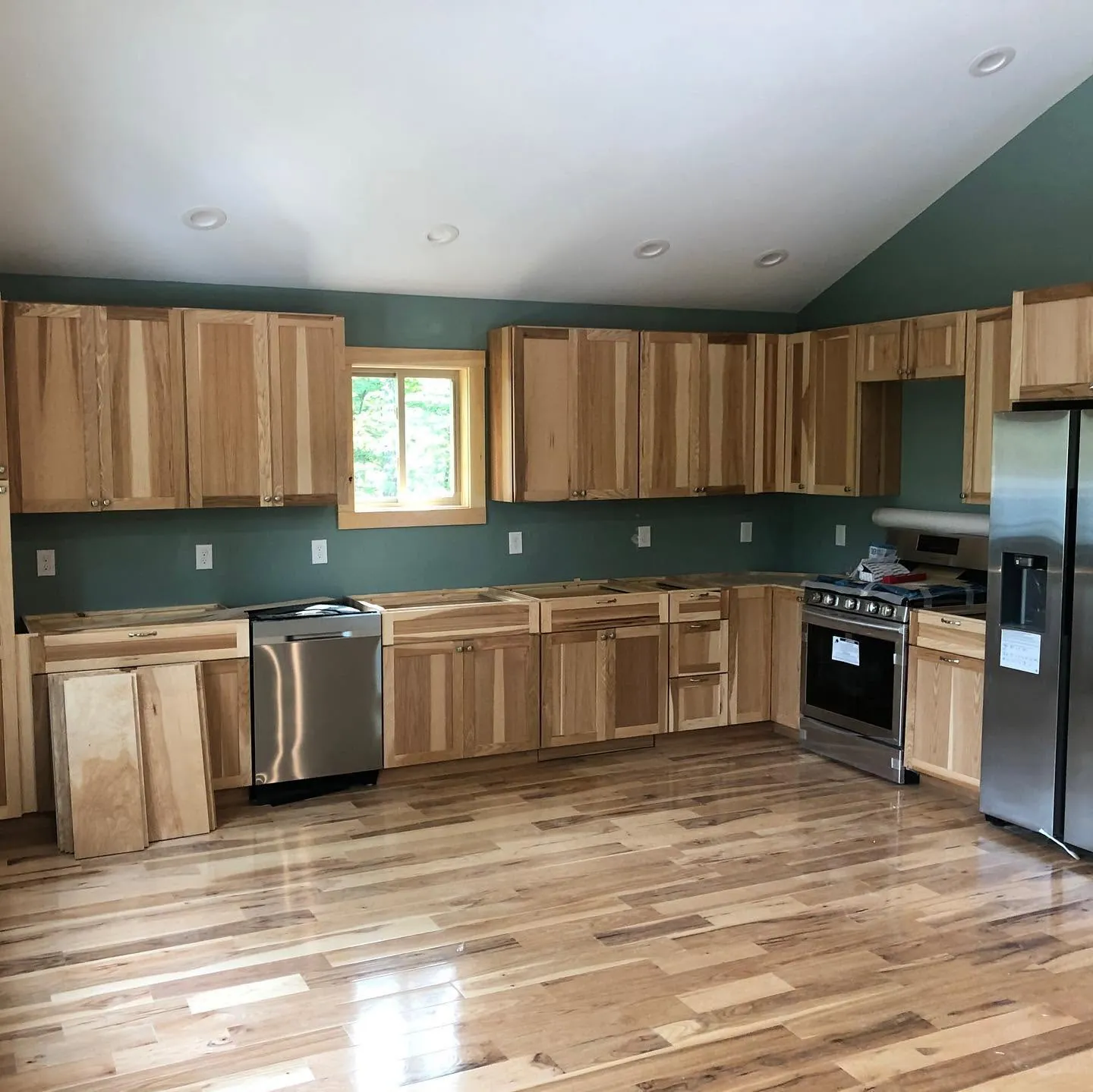 Kitchen with natural wood cabinets — General Contracting project in Central NH by A&E Home Improvement