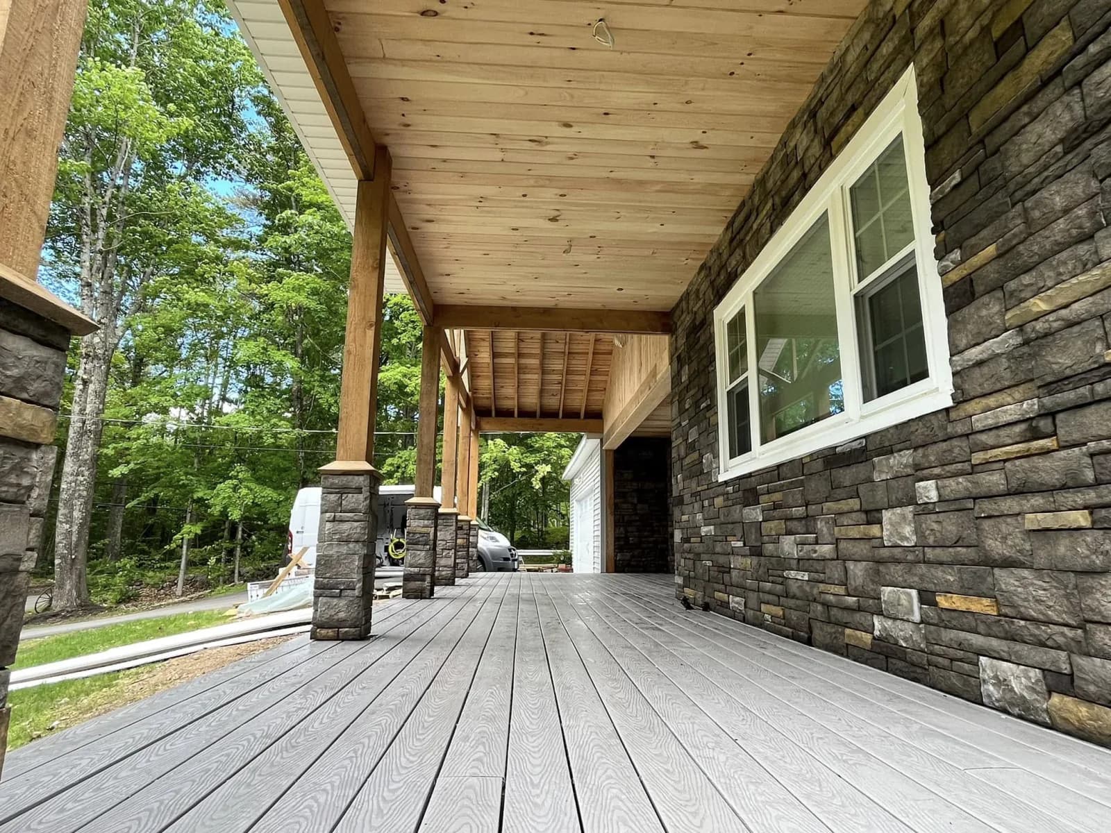 Covered porch with stone columns — Custom build project in Central NH by A&E Home Improvement