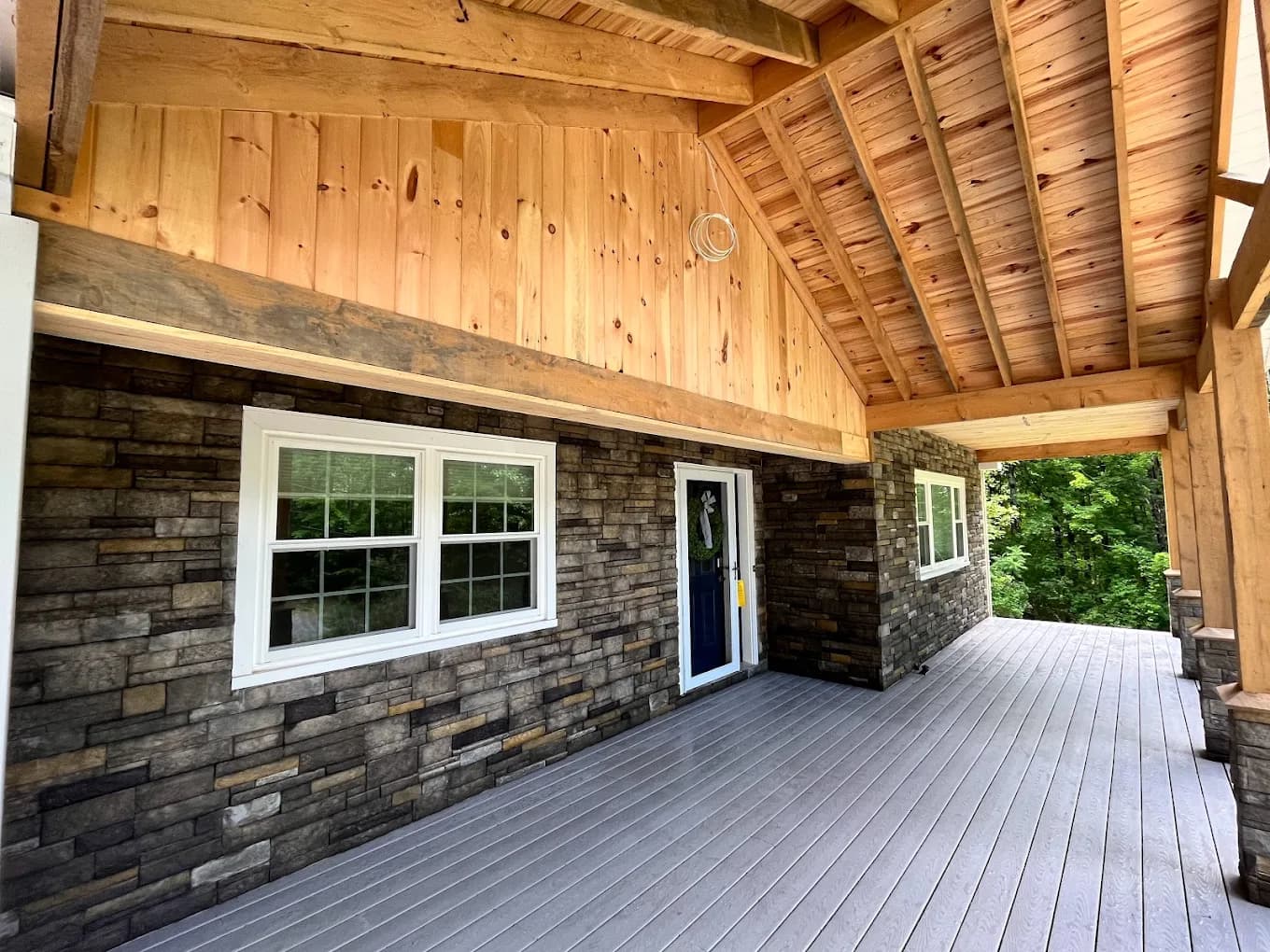 Covered stone porch — Custom build project in Lakes Region, NH by A&E Home Improvement