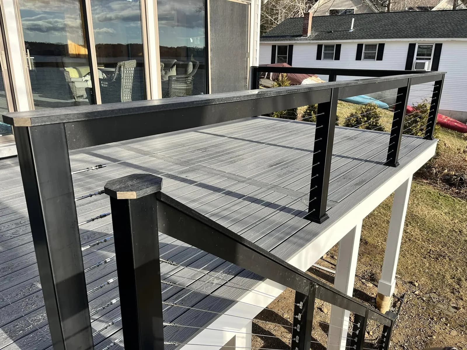 Composite deck with black cable railing — Decks project in Lakes Region, NH by A&E Home Improvement