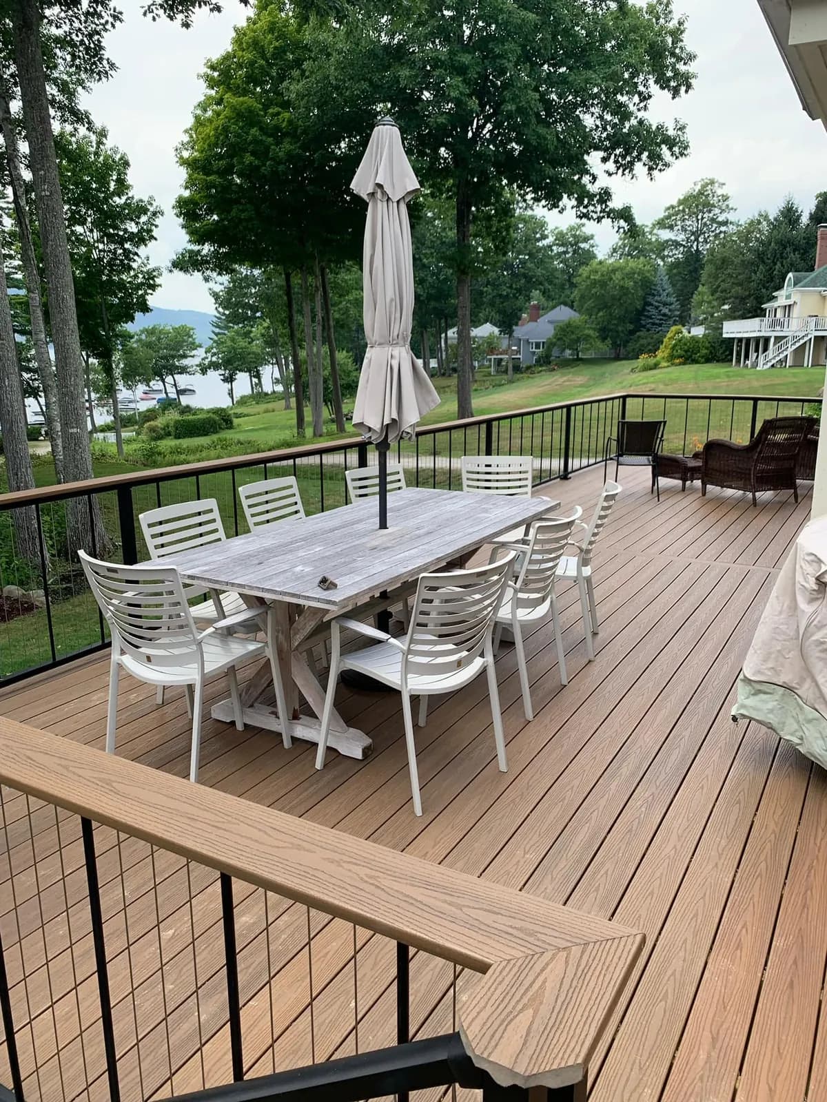 Composite deck overlooking the lake — Decks project in Lakes Region, NH by A&E Home Improvement