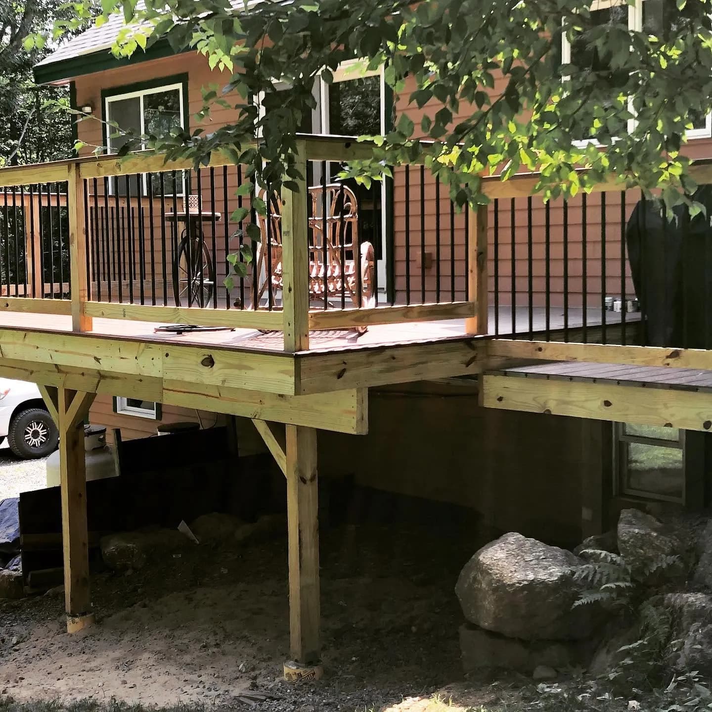 Elevated deck with black balusters — Decks project in Central NH by A&E Home Improvement