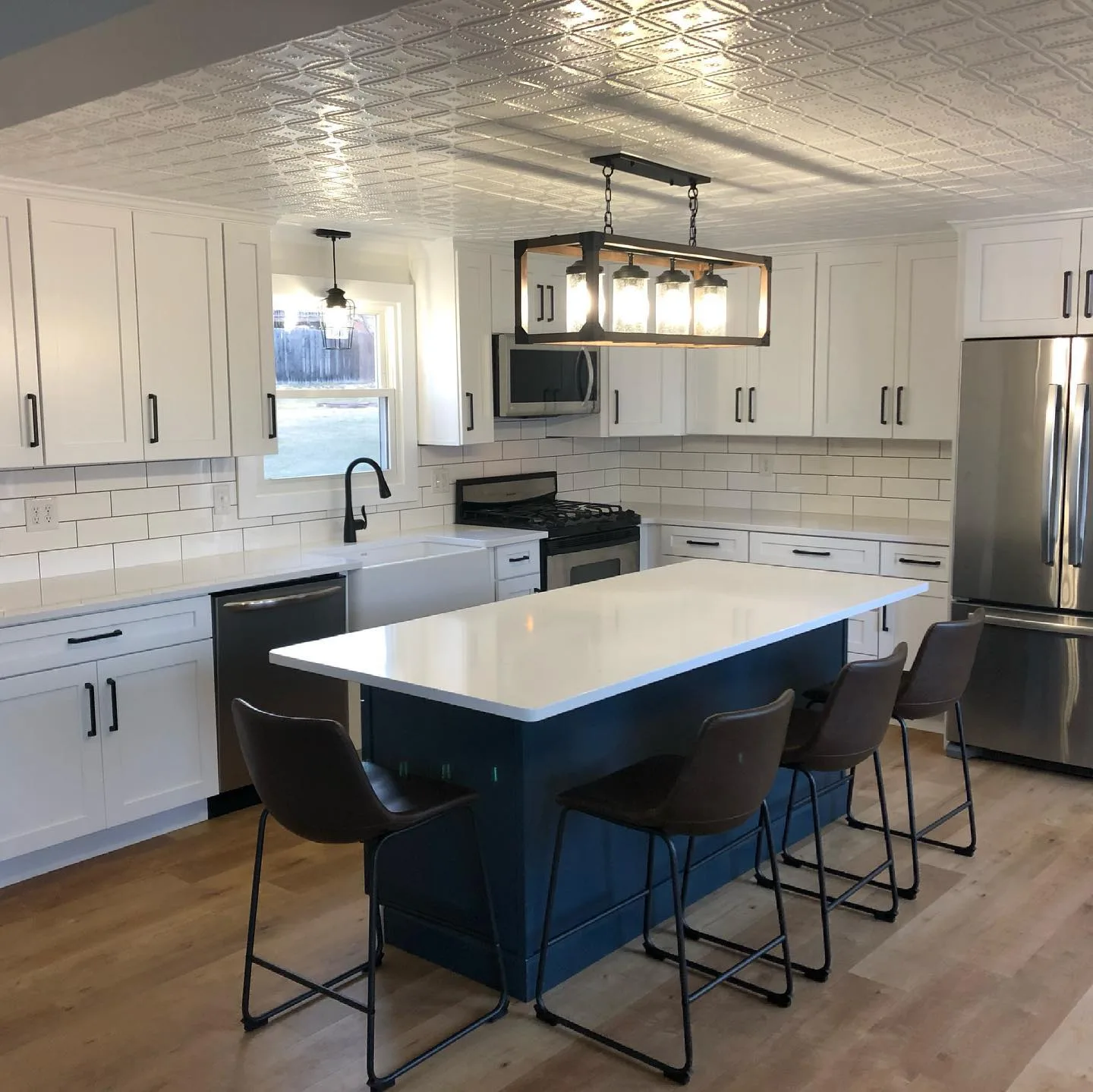 Kitchen remodel with blue island — General Contracting project in Central NH by A&E Home Improvement
