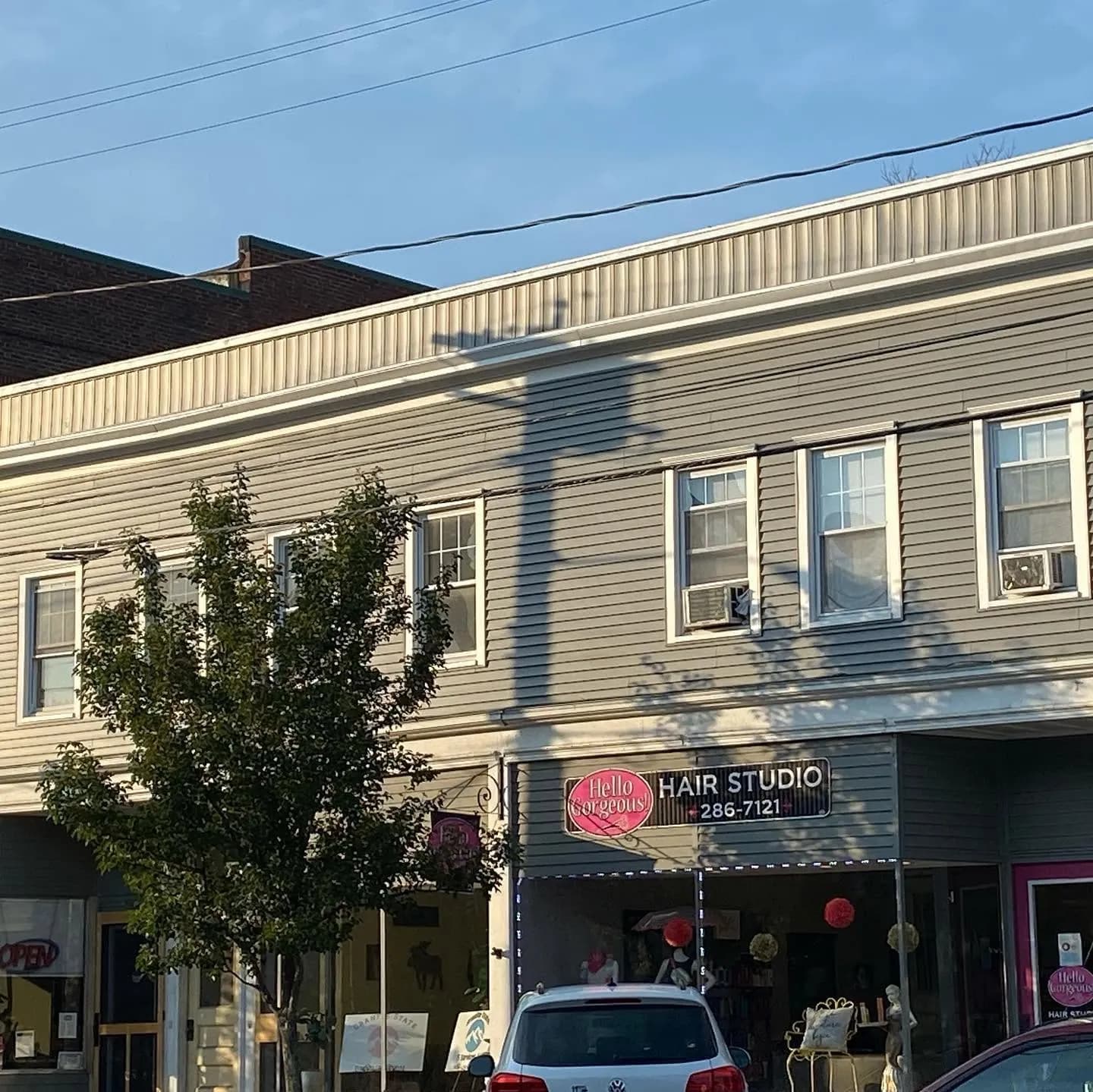 Gray vinyl siding on a two-story commercial block — Siding project in Central NH by A&E Home Improvement